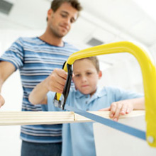 stock photo of father and son working